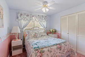Bedroom featuring carpet, a closet, and ceiling fan