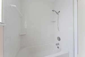 Full bath featuring shower / tub combination