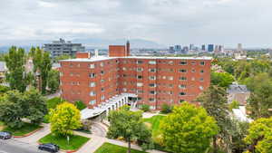 View of building exterior featuring a view of city and a mountain view