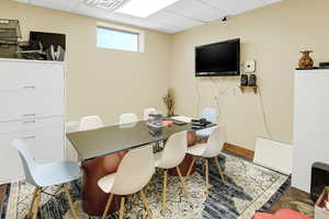 Dining space with a drop ceiling