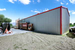 View of pole building with a mountain view