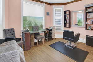 Office space with light wood finished floors and baseboards