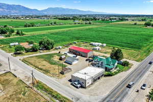 Overview of rural landscape with a mountain backdrop and farmland