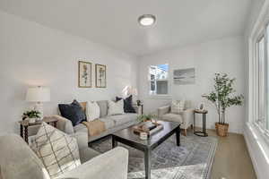 Living room featuring wood finished floors and baseboards