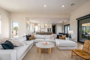 Living room with recessed lighting and wood finished floors