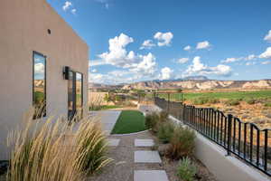 Fenced backyard with a mountain view
