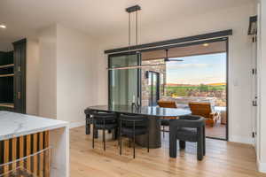 Dining room featuring light wood-style flooring, healthy amount of natural light, recessed lighting, and a ceiling fan