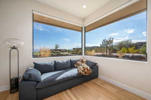 Sitting room featuring light wood finished floors and baseboards