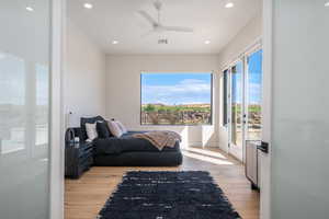 Bedroom featuring access to outside, light wood finished floors, recessed lighting, and ceiling fan