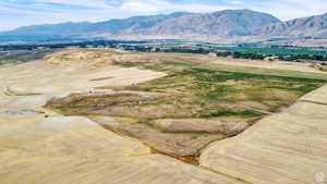 View of mountain background featuring rural landscape