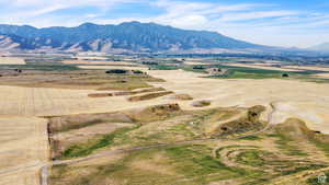 View of mountain backdrop with rural landscape
