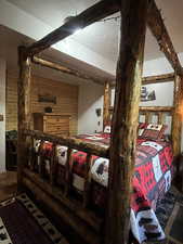 Interior space featuring a textured ceiling and wood walls