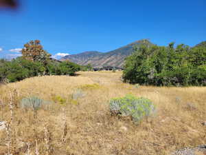 View of mountain background featuring rural landscape
