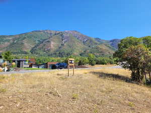 View of mountain backdrop featuring rural landscape