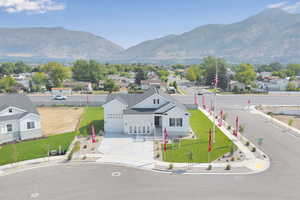 Aerial perspective of suburban area with a mountainous background