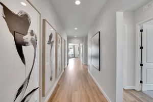 Hall featuring recessed lighting and light wood finished floors