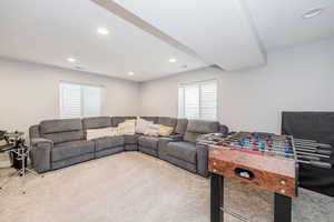Living room with carpet flooring and recessed lighting