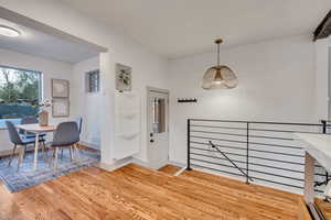 Foyer featuring light wood-style flooring and baseboards