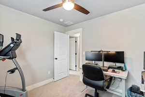 Office area with light carpet and baseboards