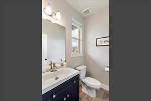 Bathroom featuring vanity and light wood-style floors