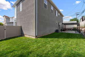 View of home's exterior featuring a pergola and stucco siding
