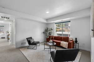 2nd Floor Foyer Area featuring light colored carpet, healthy amount of natural light, and plenty of open space