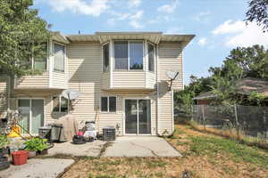 Rear view of property featuring a patio