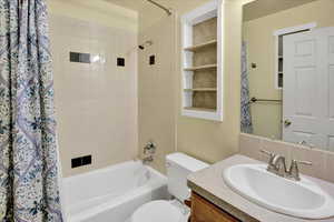 Bathroom featuring shower / bath combo and vanity