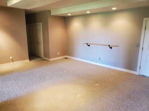 Below grade area with recessed lighting and carpet