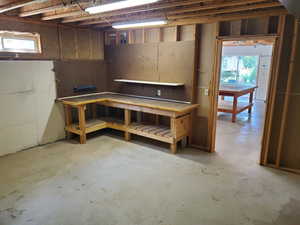 Below grade area featuring a workshop area