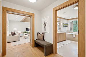 Hallway featuring light wood-type flooring and recessed lighting