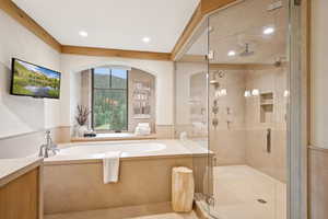 Bathroom featuring a shower stall, a bath, vanity, and recessed lighting