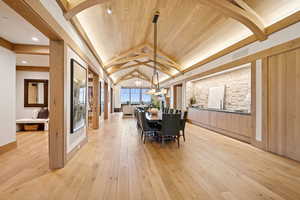 Dining room featuring light wood-type flooring and wooden ceiling