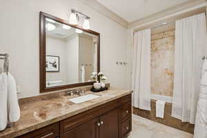 Bathroom with vanity and tiled shower / bath combo