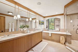 Full bathroom featuring a shower stall, a garden tub, double vanity, light tile patterned flooring, and recessed lighting