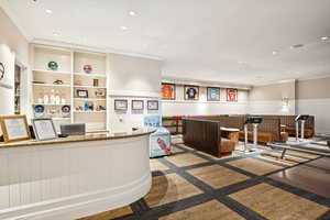 Welcome area featuring recessed lighting, wainscoting, and ornamental molding