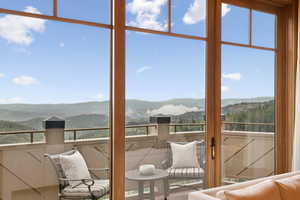 Sunroom / solarium with a mountain view