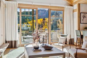 Doorway to outside with wood finished floors and a mountain view