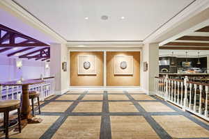 Welcome area featuring beam ceiling, recessed lighting, and ornamental molding