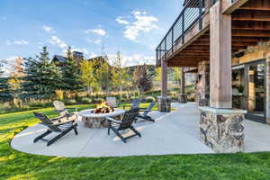 View of patio with an outdoor fire pit