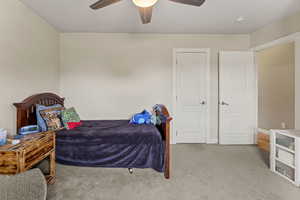 Bedroom with carpet floors and ceiling fan