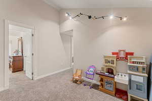 Playroom with carpet floors and baseboards