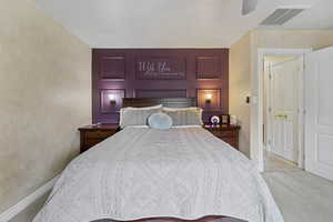 Bedroom with carpet and ceiling fan