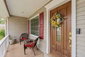 Entrance to property with a porch