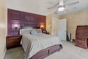 Bedroom with carpet and a ceiling fan