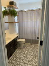 Bathroom with vanity and light tile patterned flooring