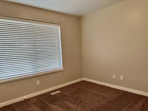 Carpeted bedroom with plenty of Southern light