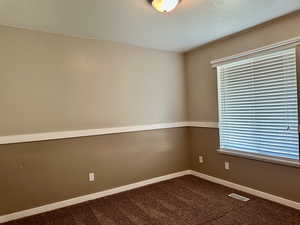 Bedroom with large window and good-sized closet