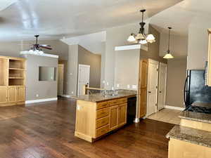 Kitchen provides a practical and welcoming space for flowing to the dining and entertainment areas