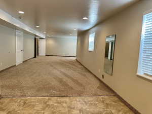 This thoughtfully designed family room offers plumbing already in place for a kitchen, easily transformed into a second living area